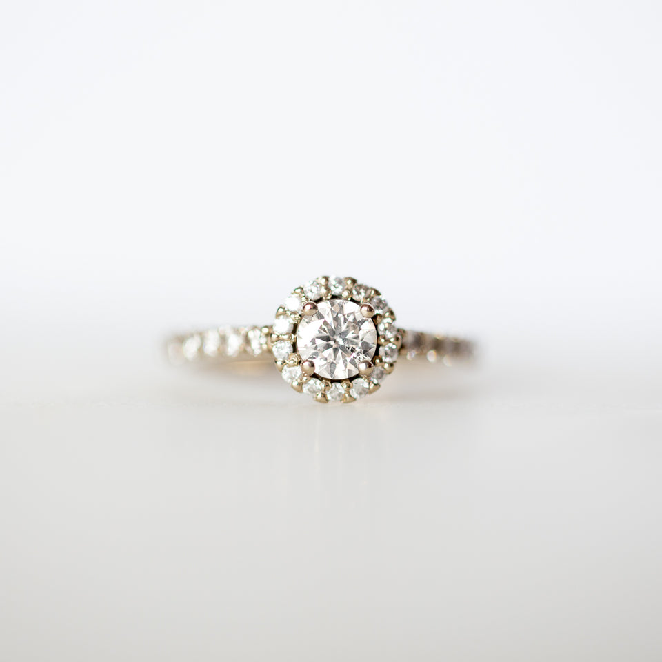 Gold Engagement ring with center stone, halo and pave band