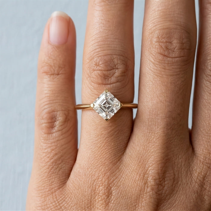 Asscher solitaire engagement ring worn on a finger - Minted Jewellery