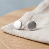 Brushed silver stud earrings on linen - Minted Jewellery