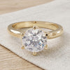 Cecilia engagement ring resting on linen - Minted Jewellery