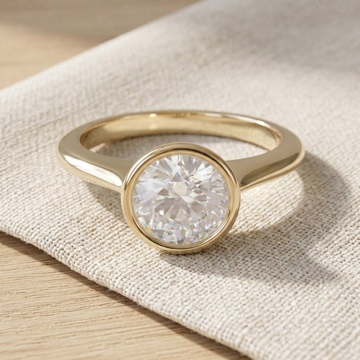 Claudia engagement ring resting on linen - Minted Jewellery