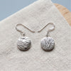 Silver coin drop earrings on linen - Minted Jewellery
