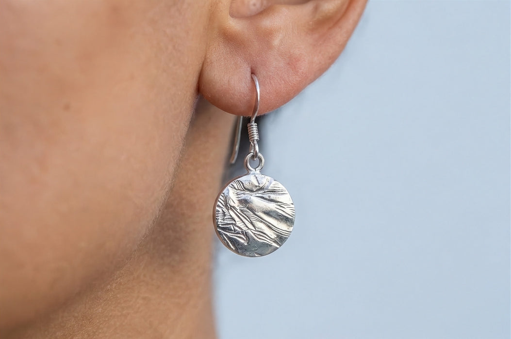 Silver coin drop earring worn - Minted Jewellery