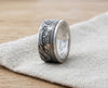 Isle of Man silver Angel coin ring resting on linen - Minted Jewellery