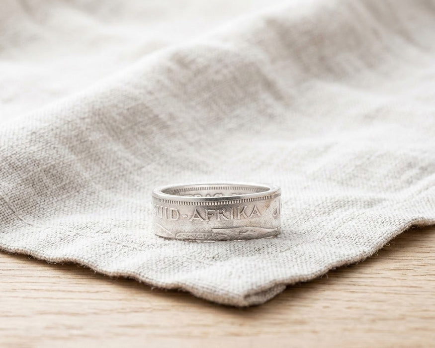 South Africa 1c coin ring resting on linen - Minted Jewellery
