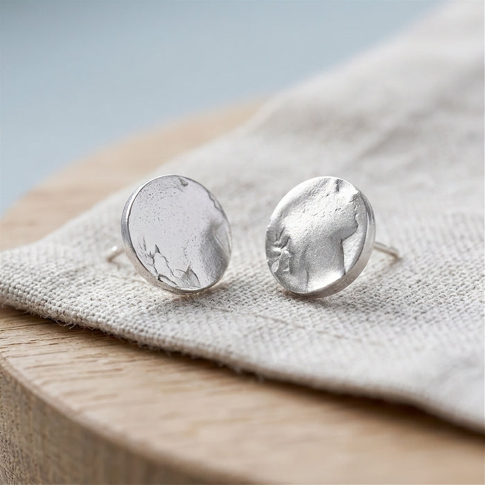 Silver coin stud earrings on linen - Minted Jewellery
