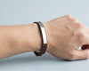 Leather bracelet with sterling silver plate worn on the wrist - Minted Jewellery