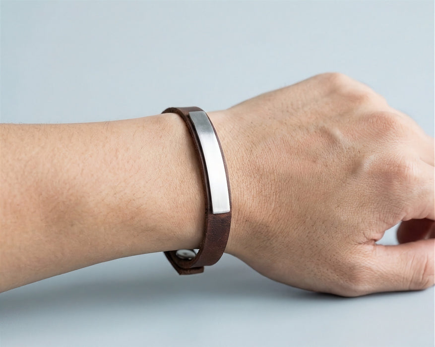 Leather bracelet with sterling silver plate worn on the wrist - Minted Jewellery