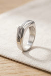Mens silver meteorite ring resting on linen - Minted Jewellery