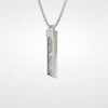 Side view of the Muonionalusta meteorite tag, with its chamfered edge and loop - Minted Jewellery