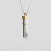 Side view of the Seymchan meteorite tag, with its 9ct gold cap and band - Minted Jewellery