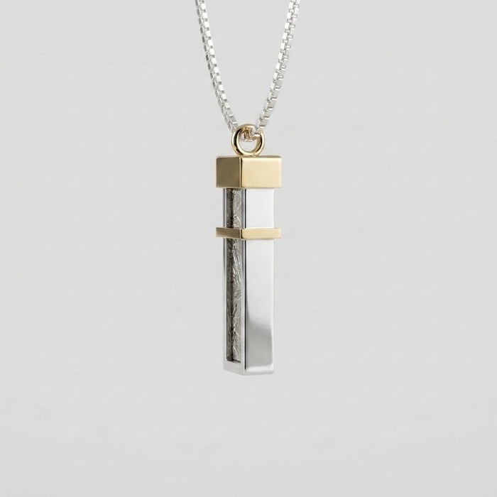 Side view of the Seymchan meteorite tag, with its 9ct gold cap and band - Minted Jewellery