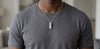 Seymchan meteorite tag necklace worn over a grey t-shirt - Minted Jewellery