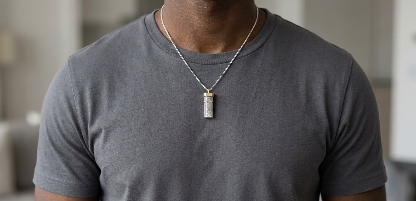 Seymchan meteorite tag necklace worn over a grey t-shirt - Minted Jewellery
