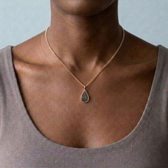 Seymchan meteorite teardrop necklace in rose gold, worn at the collarbone - Minted Jewellery