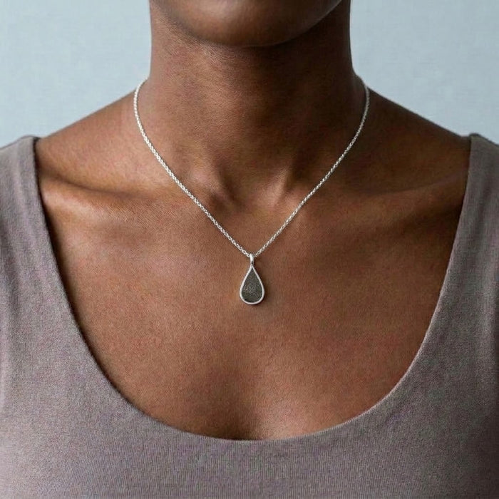 Seymchan meteorite teardrop necklace in silver, worn at the collarbone - Minted Jewellery