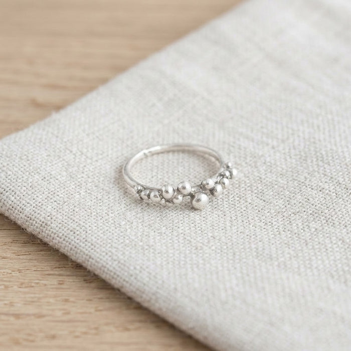 Silver grain ring resting on linen - Minted Jewellery