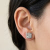Square Muonionalusta meteorite stud earring in sterling silver, worn on the earlobe - Minted Jewellery